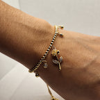 Pulsera de Balines con Dije Flor | Oro chino Dorada