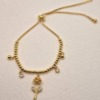 Pulsera de Balines con Dije Flor | Oro chino Dorada