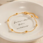 Pulsera Tejido Snake con Estaciones de Cuentas Lisas | Dorado