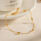 Pulsera Tejido Snake con Estaciones de Cuentas Lisas | Dorado