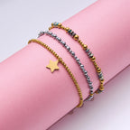 Pulseras Elásticas con Cuencas Facetadas y Dije de Estrella | Dorado y Plateado