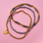 Pulseras Elásticas con Cuencas Facetadas y Dije de Estrella | Dorado y Plateado