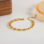 Pulsera De Eslabones Ovalados Con Detalles De Nudos Centrales | Dorado